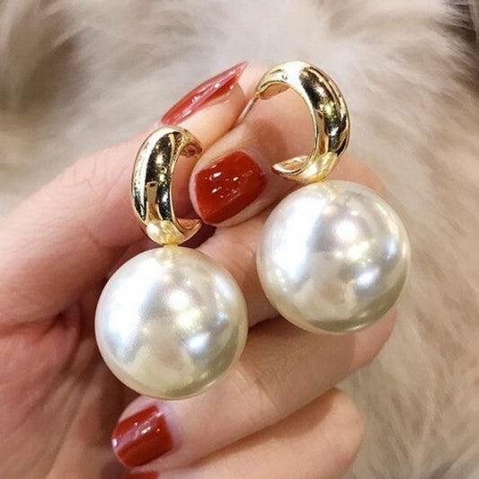 Pendientes de oro elegantes con grandes perlas