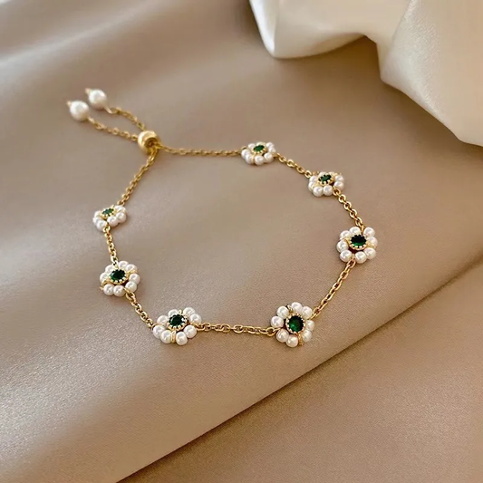 Brazalete de margaritas elegante con brillantes cristales verdes