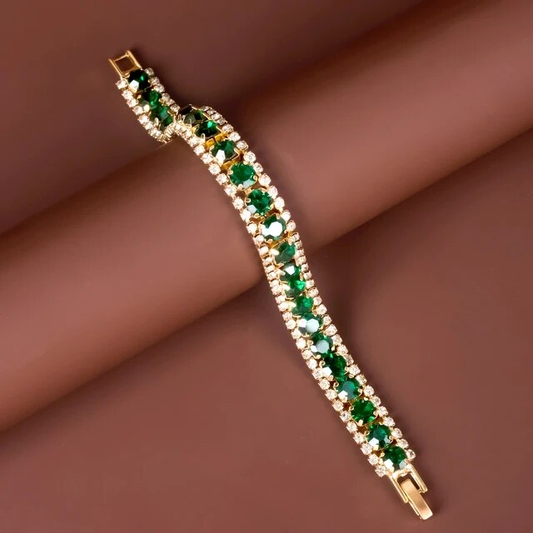 Brazalete dorado elegante con acento verde