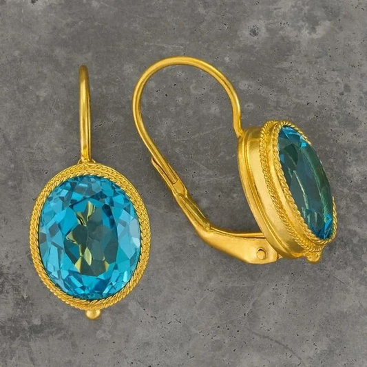 Pendientes vintage elegantes con resplandeciente cristal azul y lujosa acabado en oro